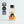 Load image into Gallery viewer, In the centre of the page is a single-serve cocktail in a cute looking small glass bottle, with a black aluminium cap. To the left of the page are some award logos. Three starts (the highest) from Great Taste in 2022. IWSC Silver 2024, and Bronze in the Great British Food Awards 2023. The cocktail is a Lychee Martini and the label is chequered pink and orange, and white. In the centre is a circle and a picture which looks likes Tina Turner  in the centre, with a yellow background.
